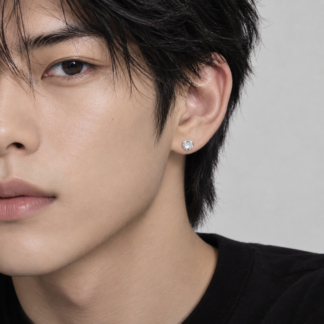 Moonstone silver ear stud worn by male model