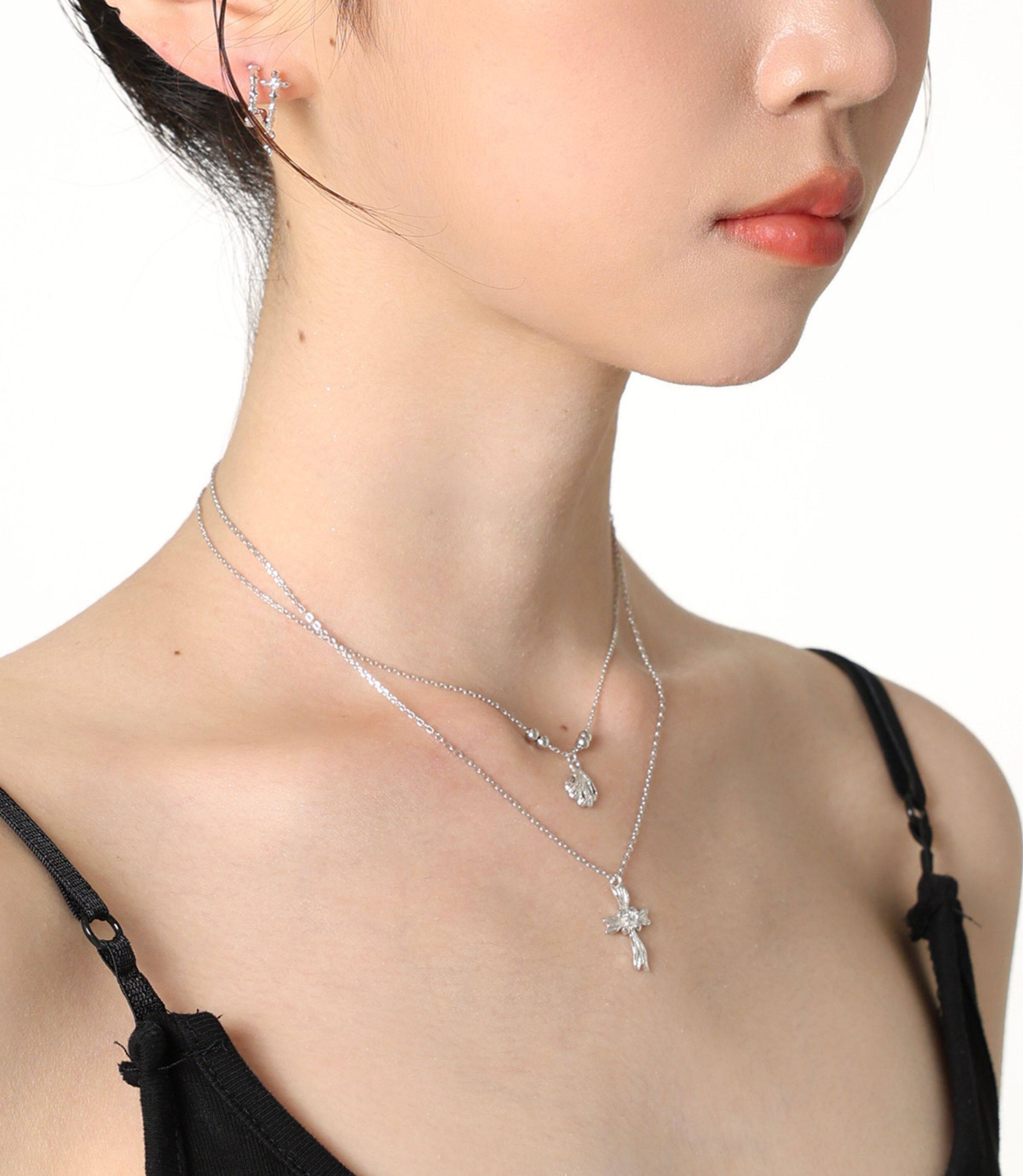 Dainty sterling silver double layered shell and floral cross necklaces by Jentle Jewelry