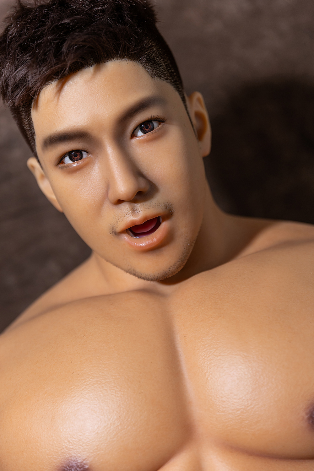 Realistic male sex doll close-up of face and chest, open mouth, seamless skin