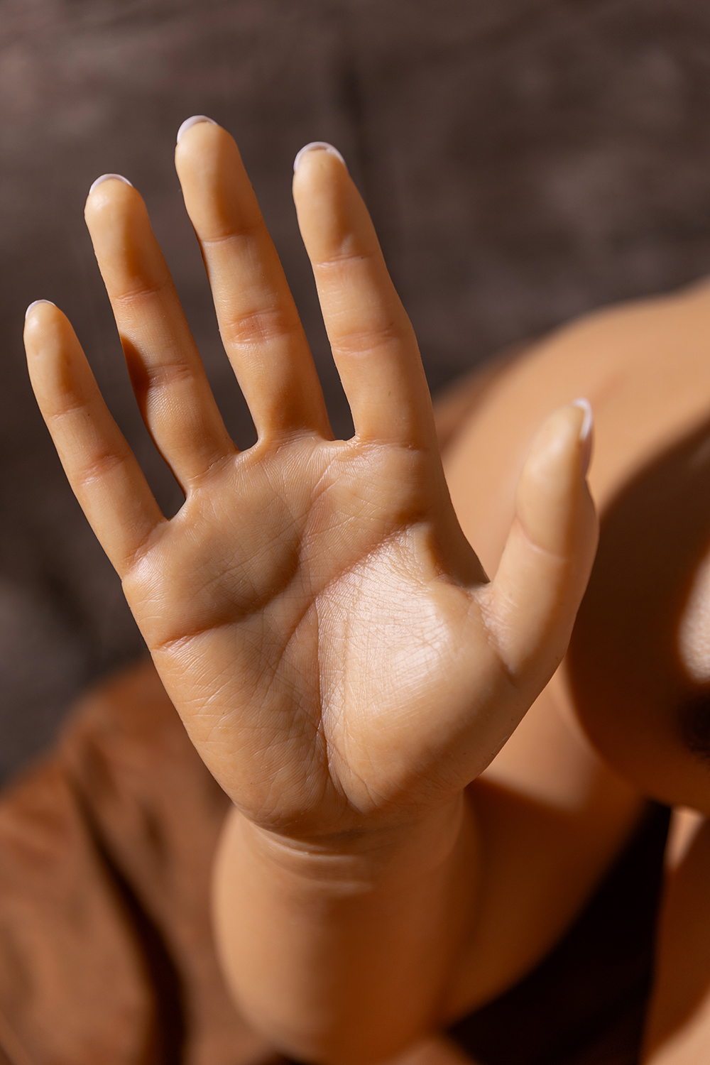 Realistic silicone hand detail on male sex doll