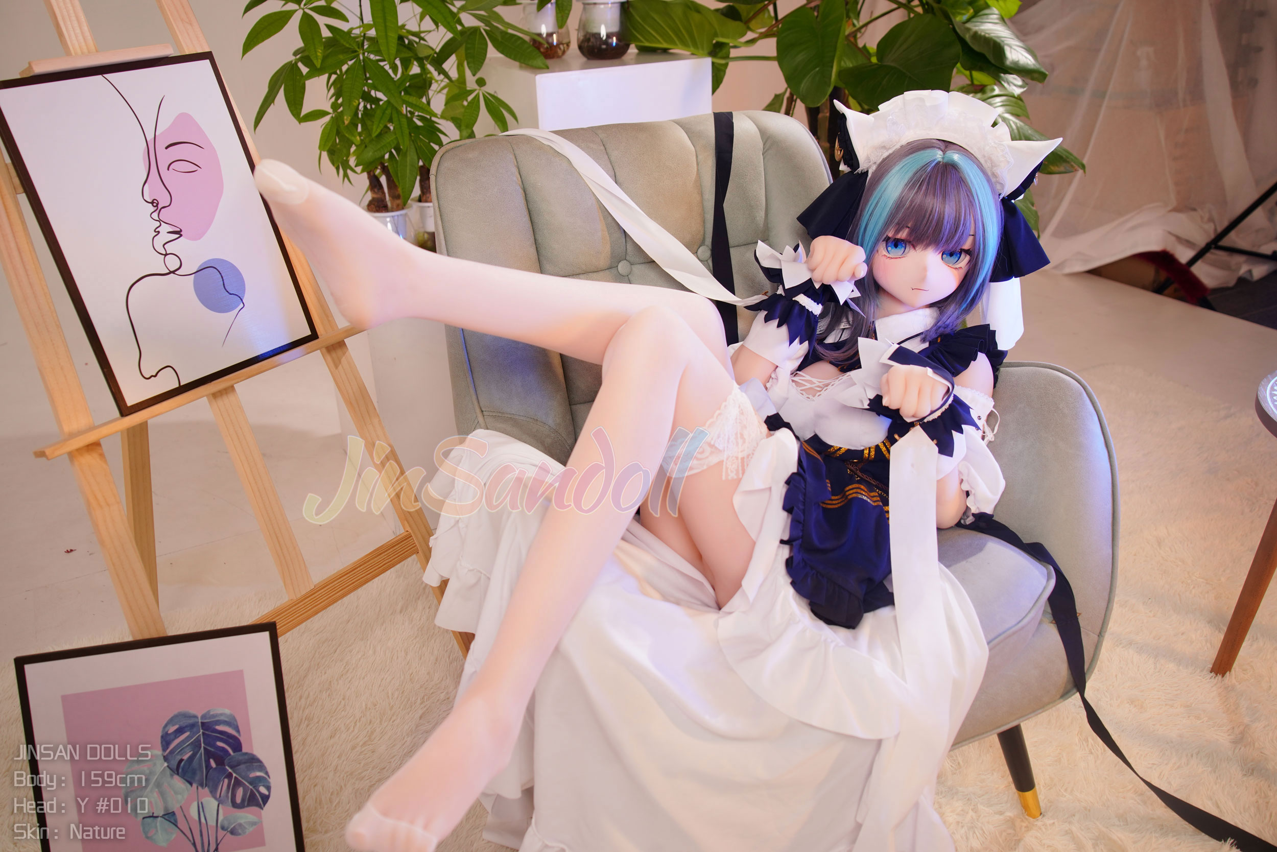 Anime sex doll wearing maid outfit, sitting on chair