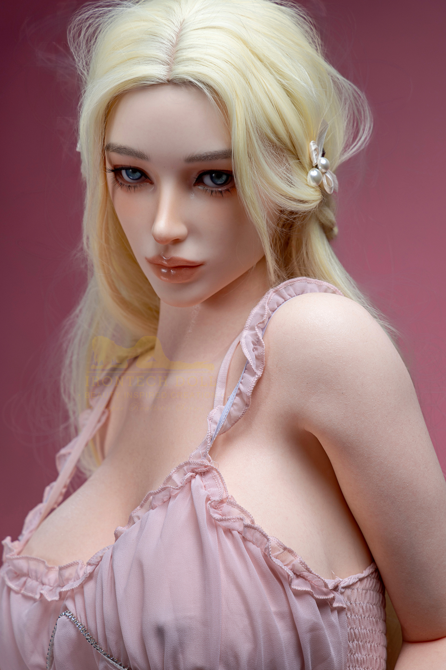 Bailey sex doll close up with blonde hair, blue eyes and pink dress, Irontech Doll