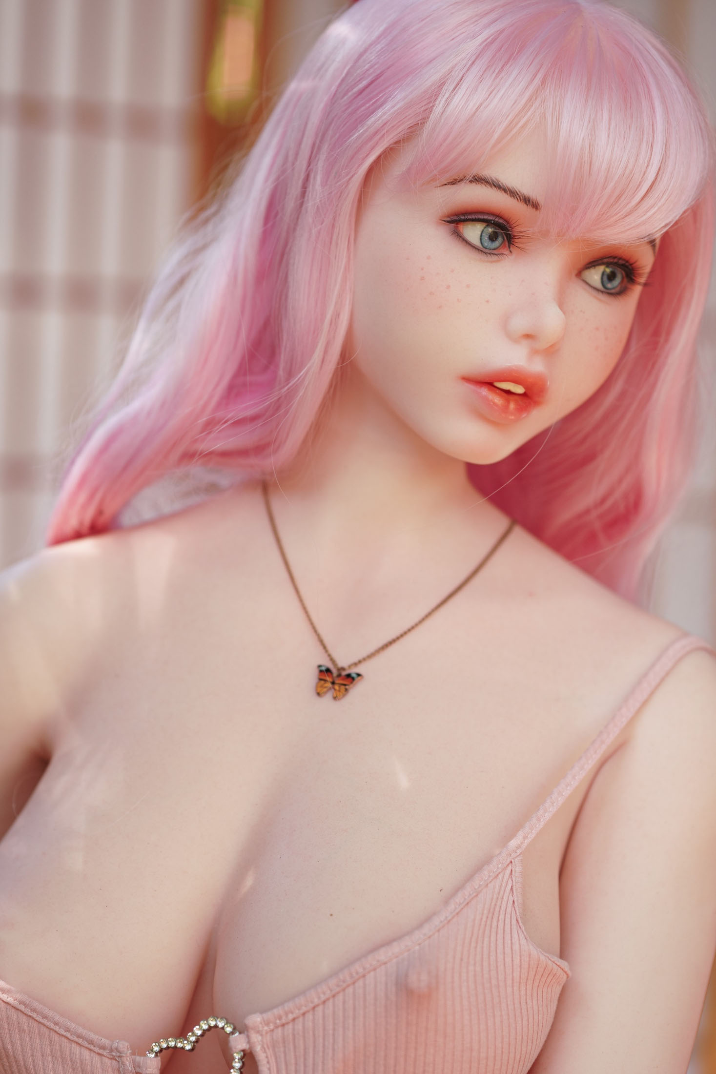 Ariel silicone sex doll with pink hair and butterfly necklace