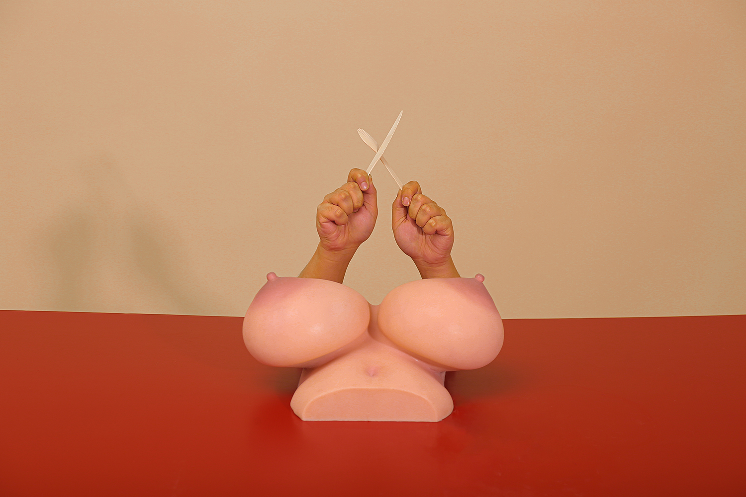 Breast sex torso with hands holding tools
