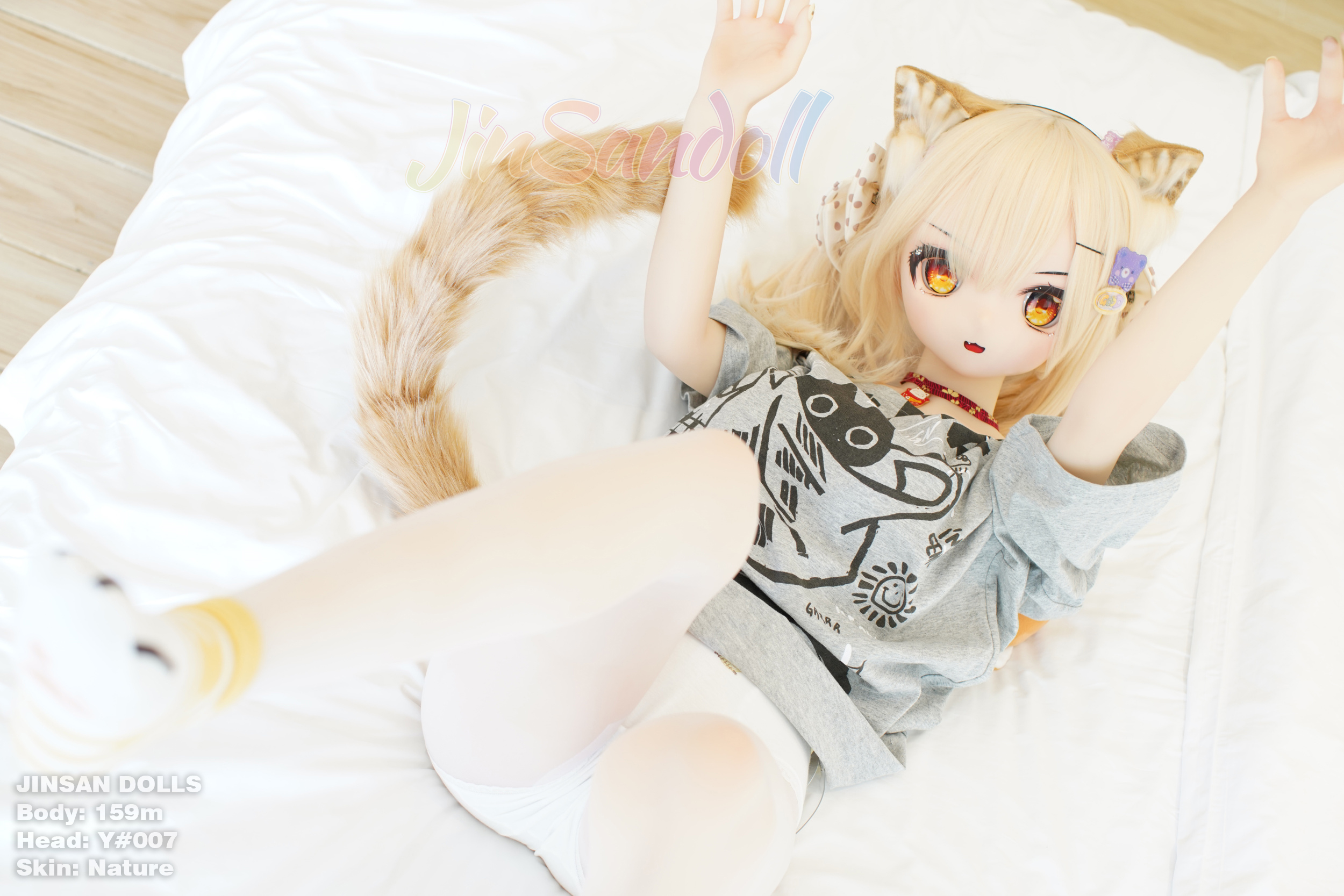 Anime sex doll Ayano with cat ears lying down on bed