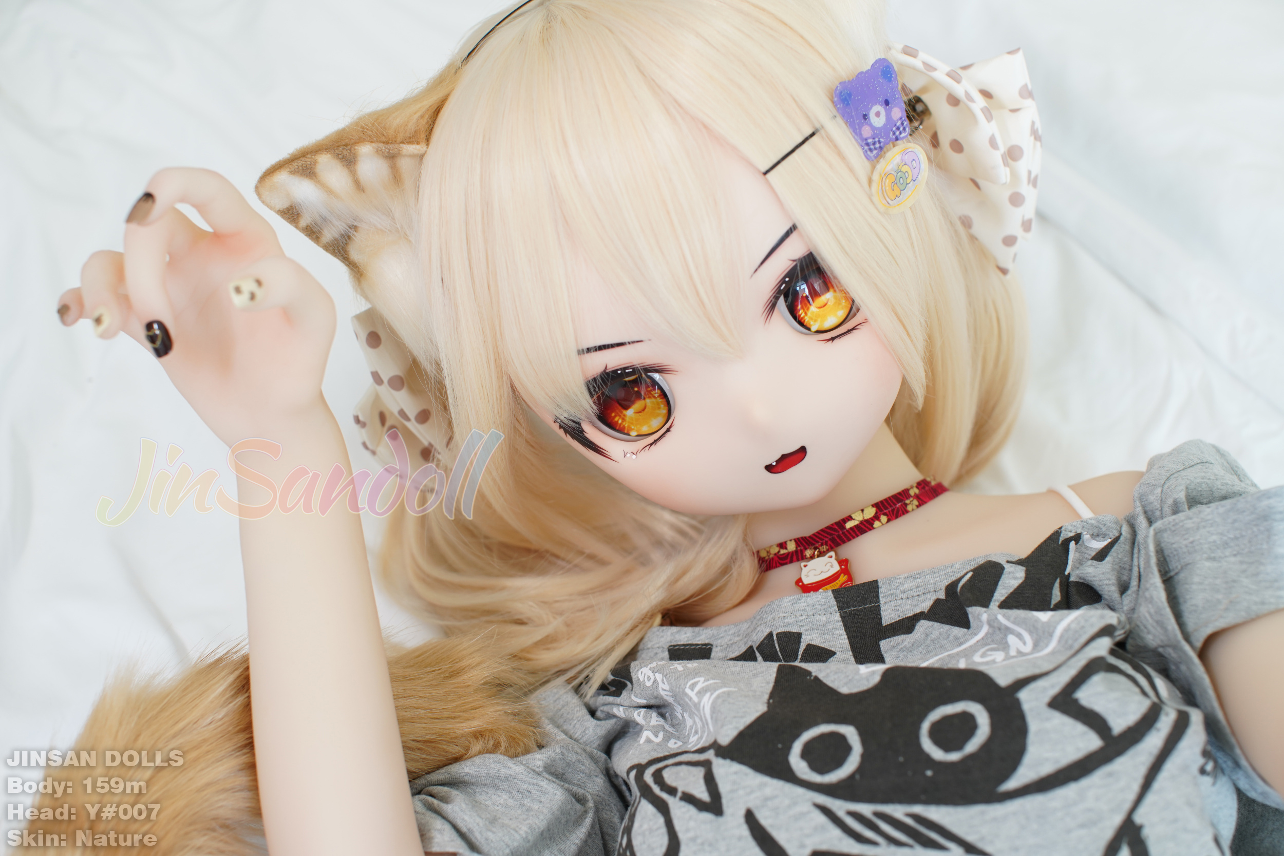 Anime sex doll Ayano with cat ears, lying down and wearing a grey shirt