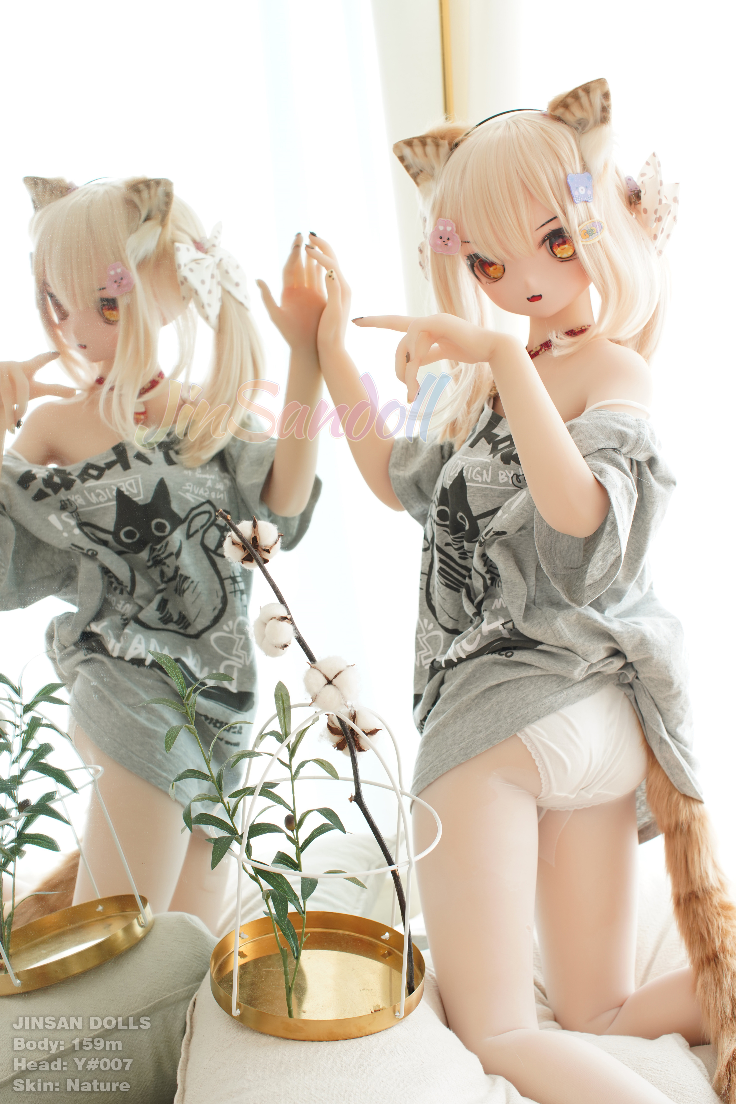 Ayano anime doll wearing cat ears, grey shirt, and a cat tail