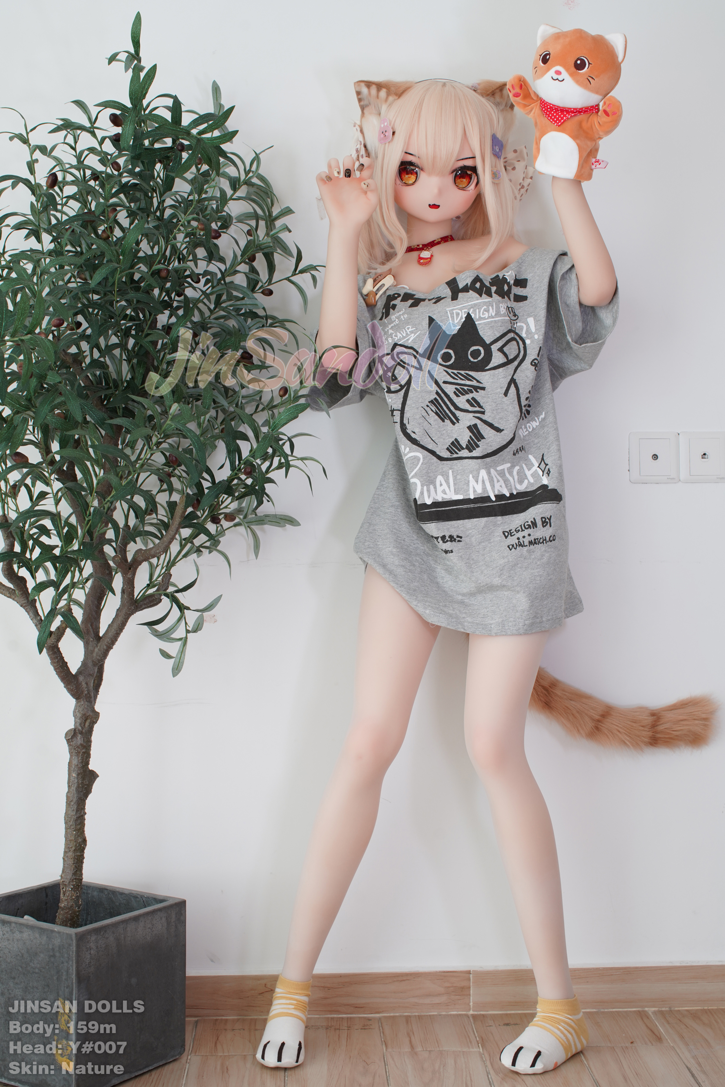 Anime doll Ayano with cat ears and tail, holding a stuffed cat toy