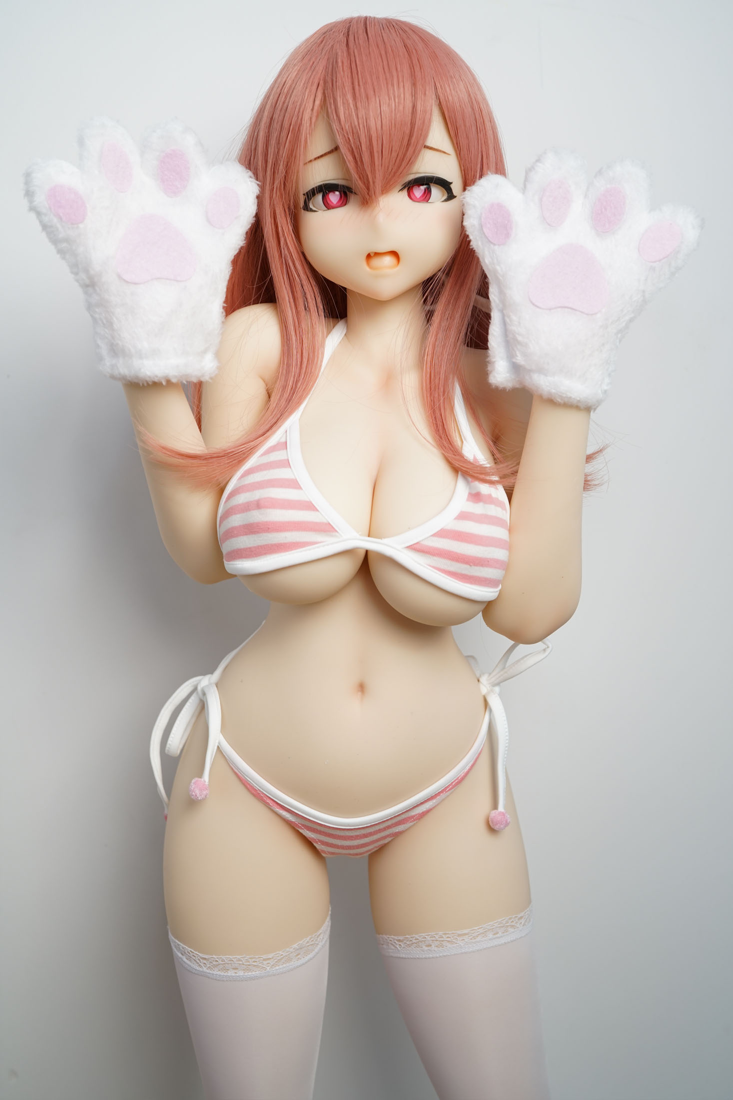 Irokebijin doll in playful pose, paw gloves, pink striped bikini