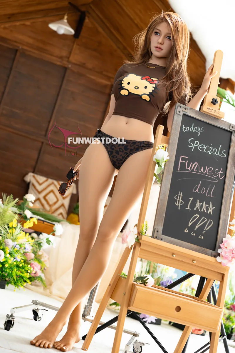 Clara stands next to the drawing board in leopard print underwear and a tight top