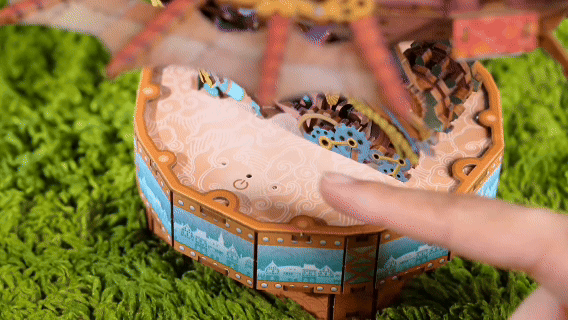 Touch-activated warm LED lights glowing inside the 3D wooden puzzle desk decor