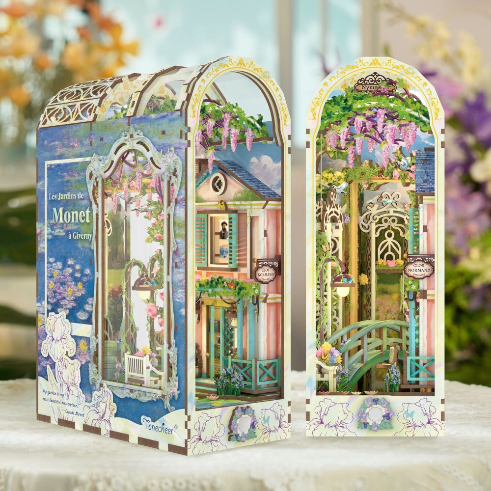 The finished product features intricate details like water lilies, an arch bridge, and artificial flowers.