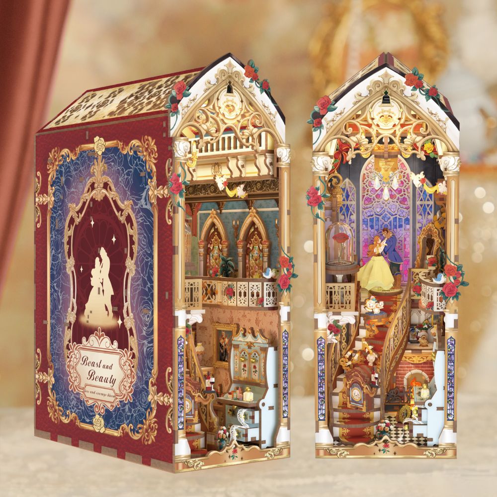 The finished product is a detailed, gothic castle scene designed to fit between books on a shelf.