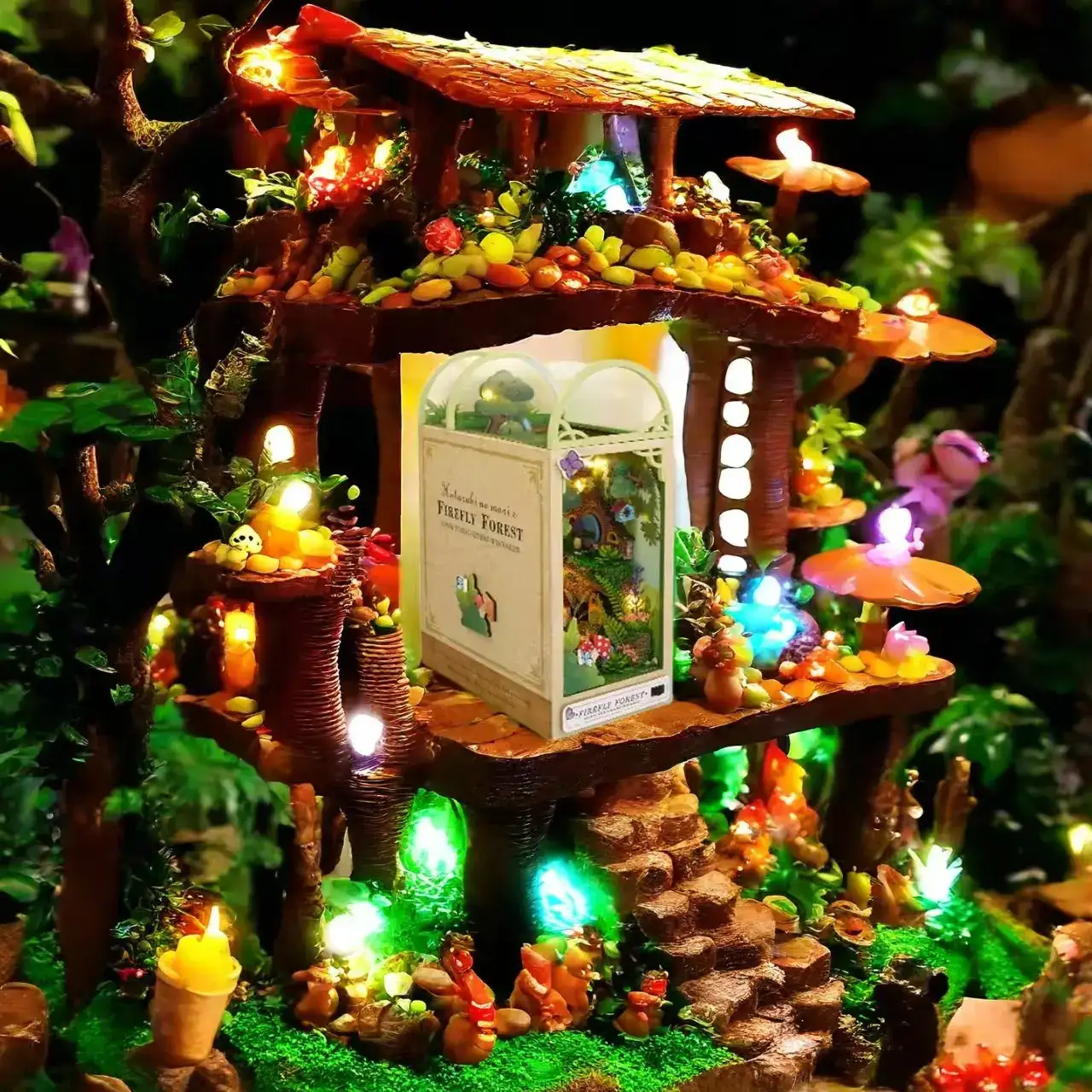 Firefly Forest DIY Book Nook Kit with miniature trees, fairy lights, and cozy book-themed decor for creative shelving.
