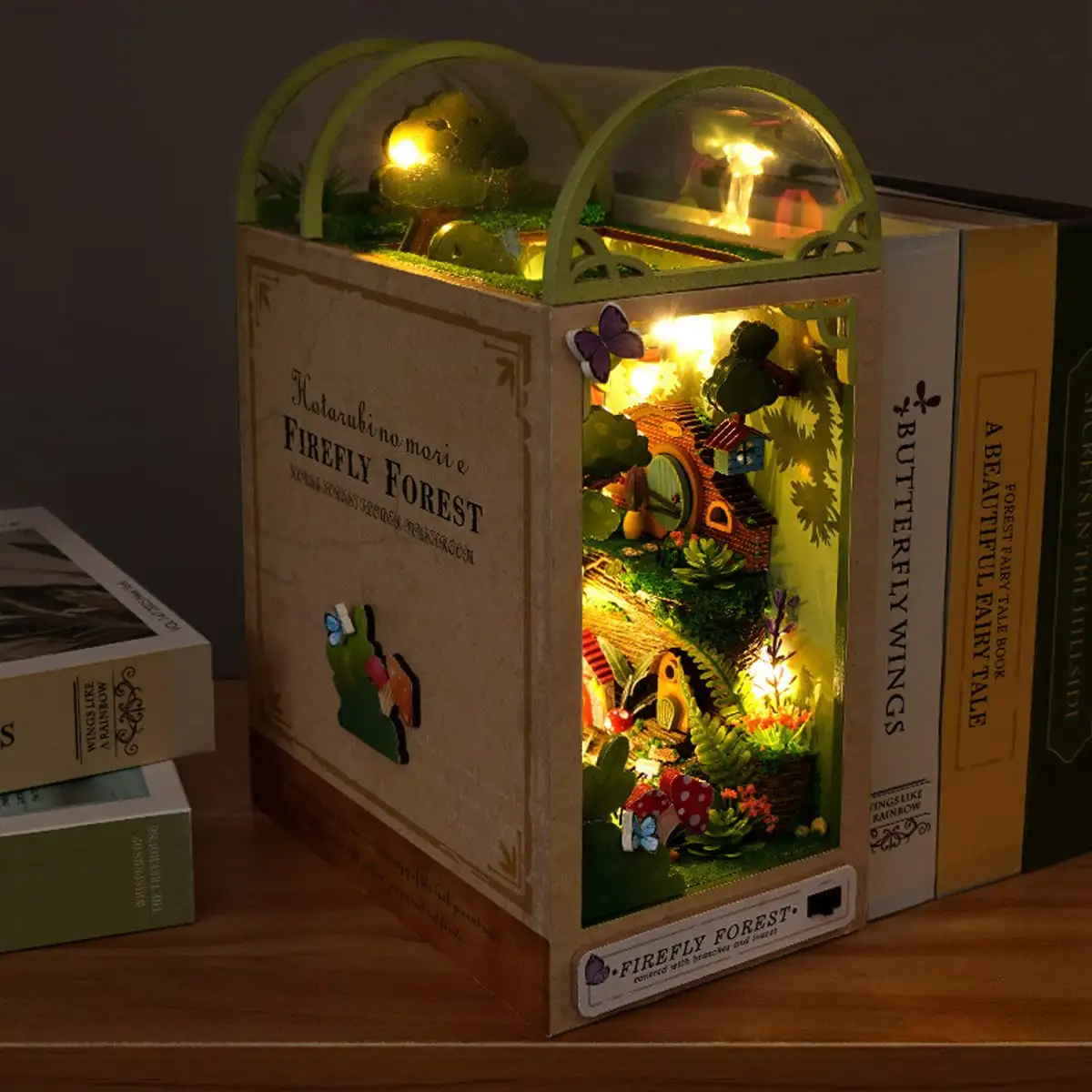 Firefly Forest DIY Book Nook Kit with miniature trees, fairy lights, and cozy reading nook design for creative decor.