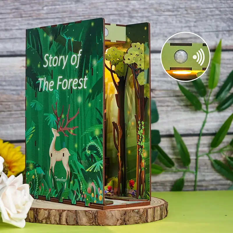 Story of The Forest DIY Book Nook Kit with miniature trees, cozy cabin, and enchanting forest scene for book lovers.