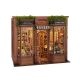 It is a 3D wooden puzzle that, once assembled, creates a miniature scene designed to fit between books on a shelf. 