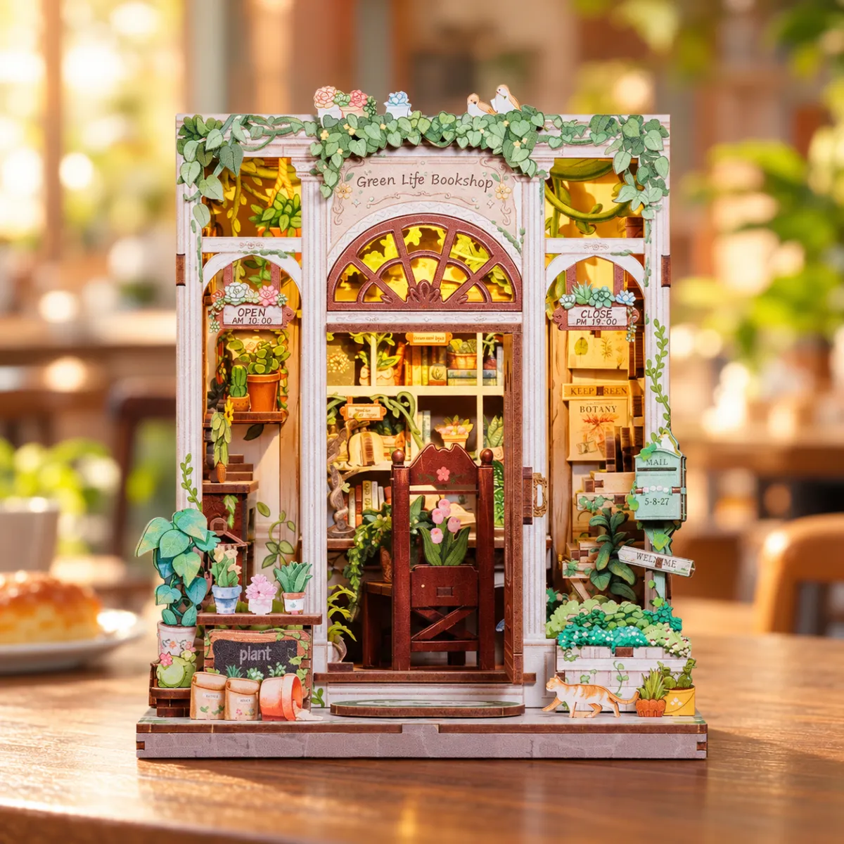 Green Life Bookshop DIY Book Nook Kit with lights on