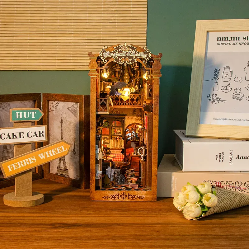 The Grimoire Grove DIY Book Nook Kit with lights on