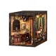 The European Melody DIY Book Nook Kit captures the elegance of a classic European music room. Featuring a grand piano, violin, and exquisite décor with floral wallpaper and velvet curtains, it exudes vintage charm. Warm lighting enhances the cozy, artistic atmosphere, making it a stunning miniature display that brings timeless melody and sophistication to your bookshelf.