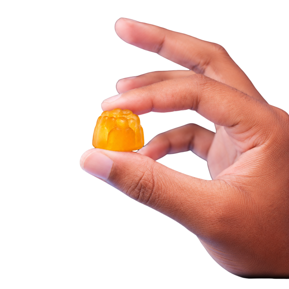 Creatine gummy held by hand