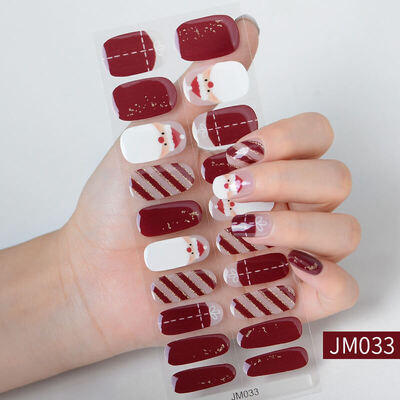 Christmas nail wraps featuring festive designs with Santa Claus, Christmas trees, and red, green, and white holiday colors.