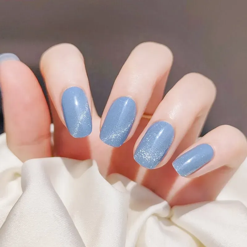 Azure Starry Gel Nail Wraps with a shimmering blue finish, ideal for an elegant and sophisticated manicure.