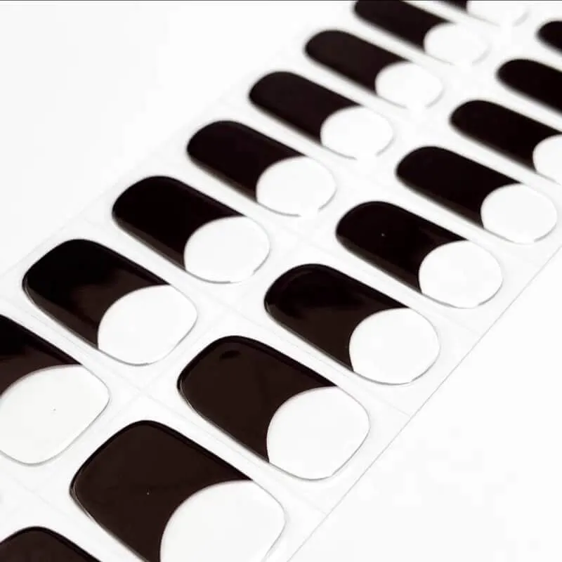 Black French Gel Nail Wraps featuring classic black tips on a nude base for an elegant and timeless French manicure look.