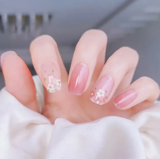 Blossom Pink Daisy Gel Nail Wraps featuring soft pink hues and delicate floral daisy designs, ideal for a fresh and elegant manicure.
