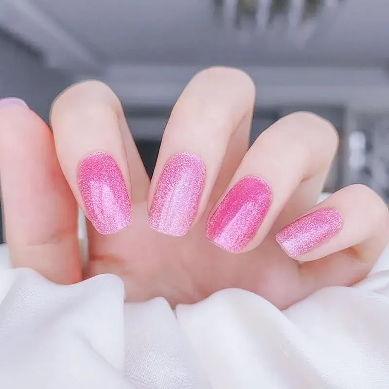 Blush Sparkle Gel Nail Wraps with a dazzling pink glitter finish, perfect for a stylish manicure.
