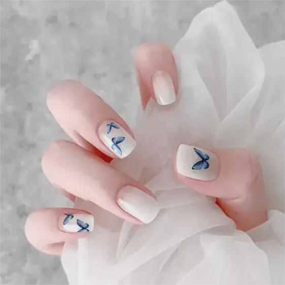 Elegant Butterfly White Gel Nail Wraps with blue butterfly accents for a minimalist and classy nail art design.