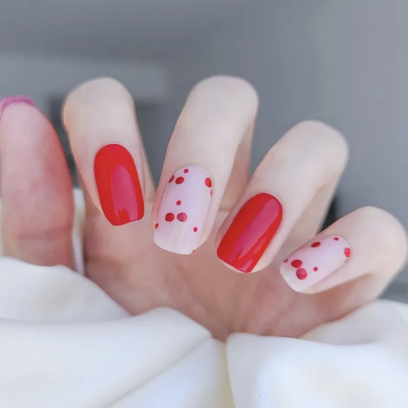 Cherry Red Polka Dot Gel Nail Wraps featuring a playful red and white design, perfect for a festive manicure.