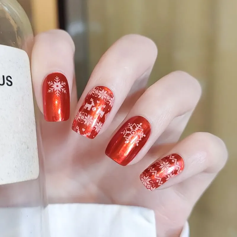 Christmas Red Gel Nail Wraps featuring festive snowflake and reindeer designs, perfect for the holiday season.