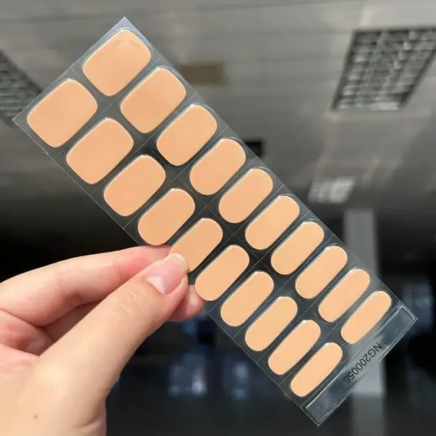 Classic nude gel nail wraps featuring a soft beige shade for an elegant and minimalist manicure.