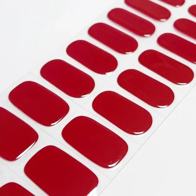 Classic Scarlet Gel Nail Wraps showcasing a vibrant red finish, perfect for bold and elegant manicures.