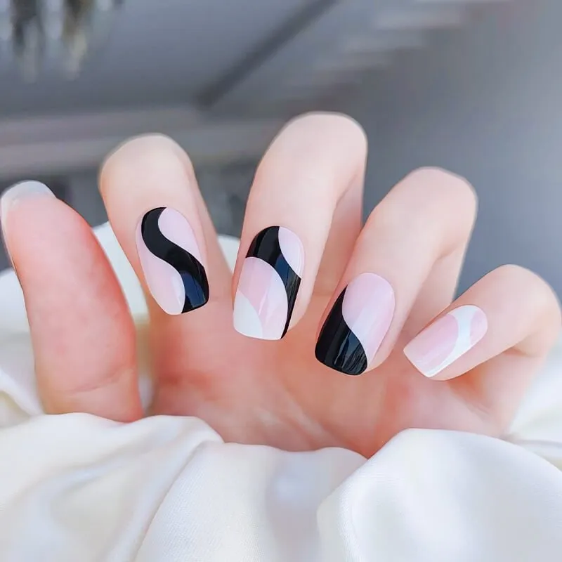 Classy Monotone Elegance Gel Nail Wraps featuring abstract black-and-white designs for a chic and minimalist manicure.