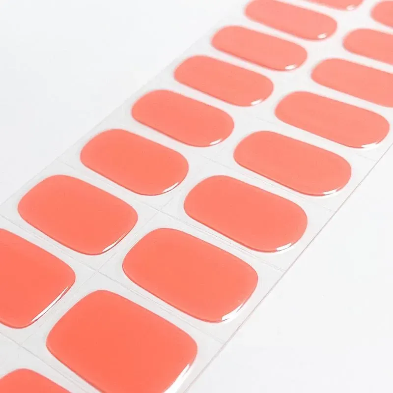 Coral Charm Gel Nail Wraps with a vibrant coral shade for summer nail art.