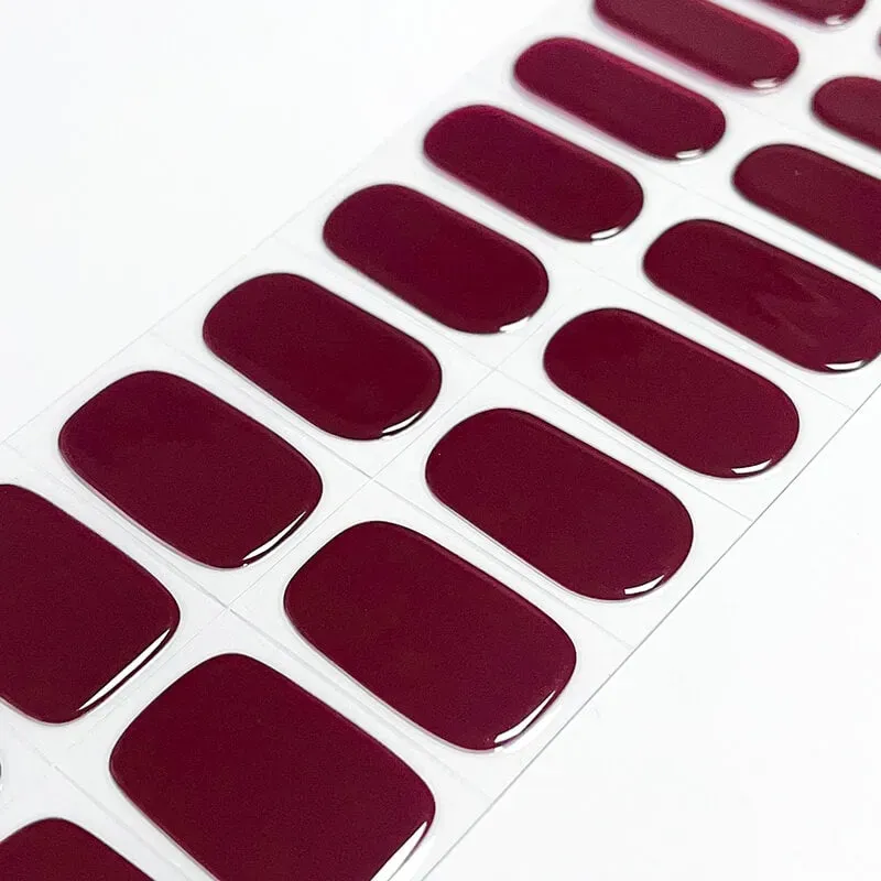 Crimson Luxe Gel Nail Wraps with a bold red finish, perfect for creating an elegant manicure at home.