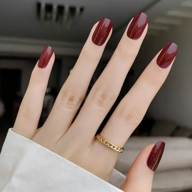 Deep Burgundy Gloss Gel Nail Wraps featuring a rich wine red shade and glossy finish for a timeless manicure.