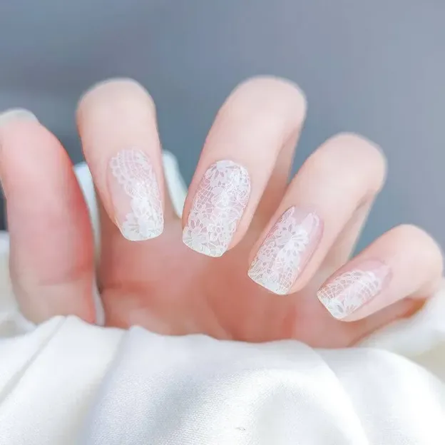 Elegant Lace Gel Nail Wraps featuring a delicate white lace design, ideal for weddings and formal events.