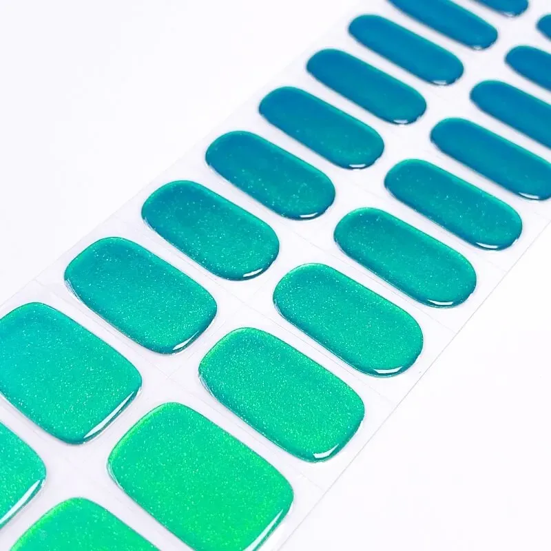 Emerald Glow Gel Nail Wraps with a sparkling green finish, perfect for achieving a luxurious manicure at home.