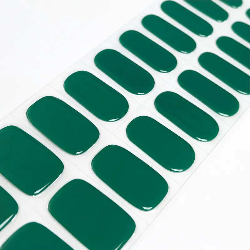 Deep forest green gel nail wraps providing a bold and sophisticated manicure look.