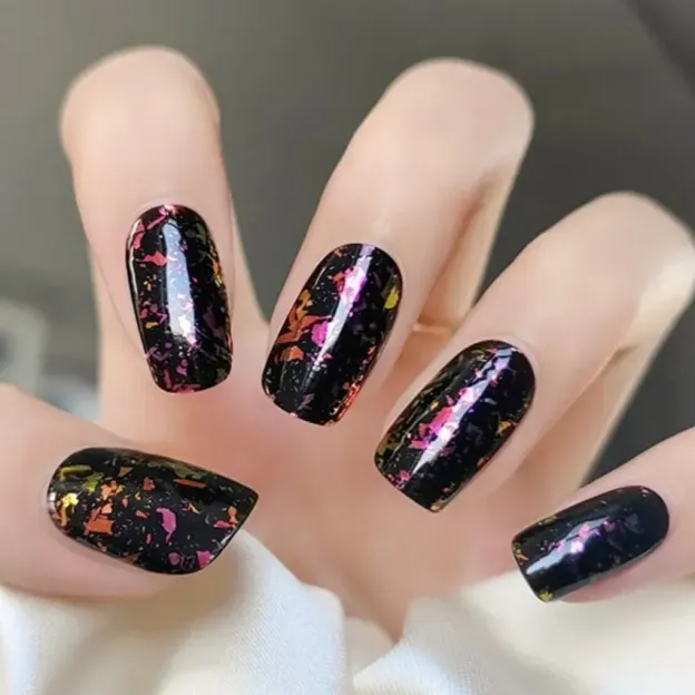 Galaxy Shimmer Gel Nail Wraps with black glitter and cosmic accents for a celestial manicure.
