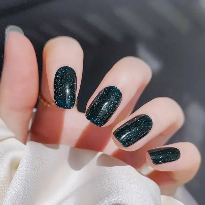 Galaxy Sparkle Gel Nail Wraps with a starry night finish, perfect for creating a cosmic-inspired manicure at home.
