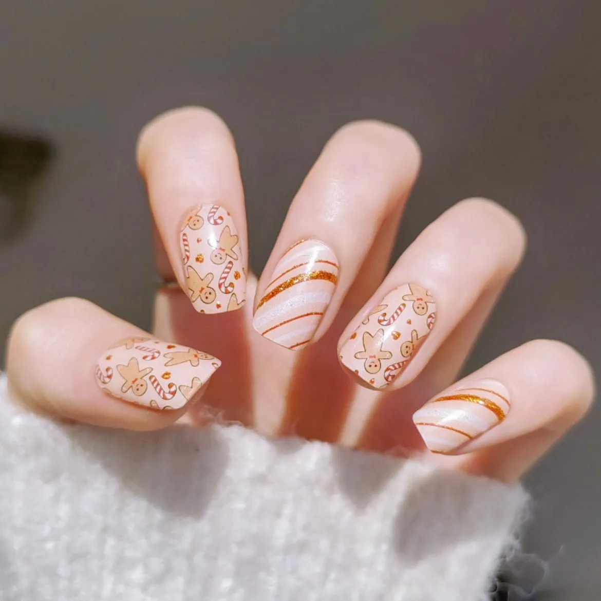 Gingerbread Holiday Gel Nail Wraps featuring gingerbread cookies and candy canes with festive sparkle.
