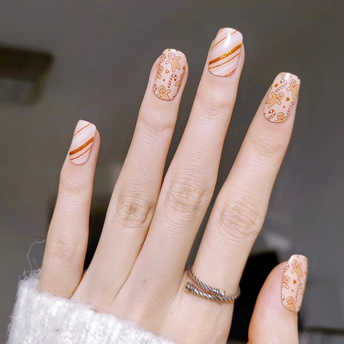 Gingerbread Holiday Gel Nail Wraps featuring gingerbread cookies and candy canes with festive sparkle.