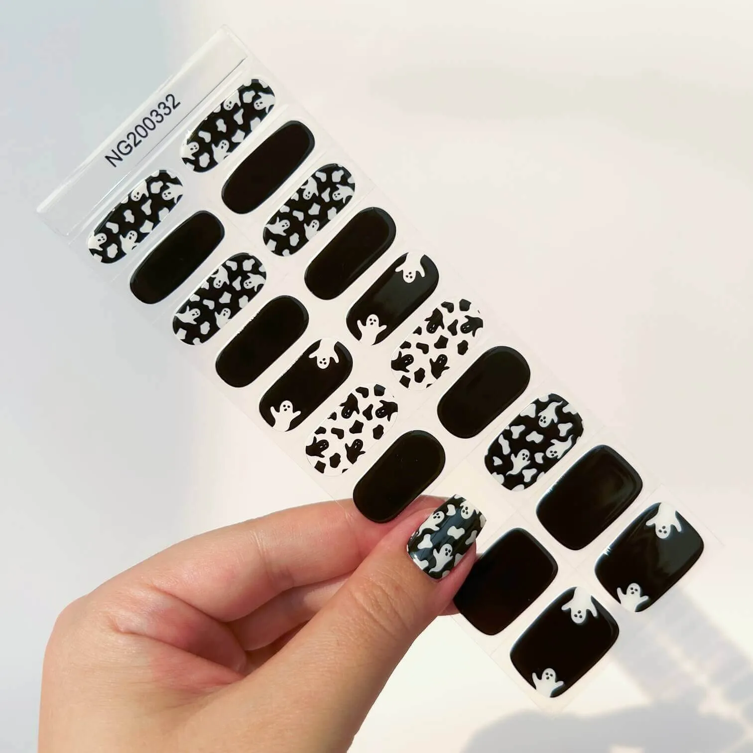 Halloween Ghost Gel Nail Wraps featuring spooky ghost designs on a black and white background, perfect for a stylish Halloween manicure.