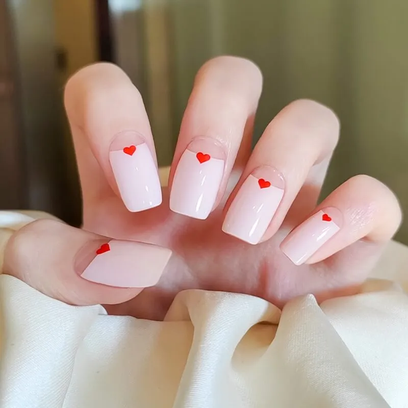 Heart Accent French Gel Nail Wraps with minimalist red heart design, perfect for romantic occasions.
