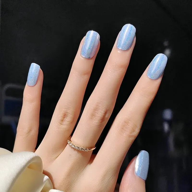 Holographic Sky Gel Nail Wraps featuring a light blue holographic shimmer, perfect for a celestial manicure.