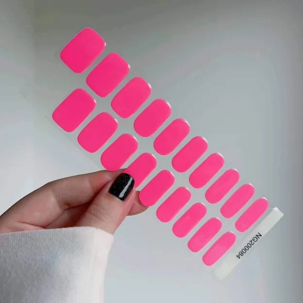 Hot pink gel nail wraps with a glossy finish for bold and vibrant nails.